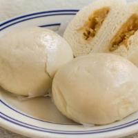 Steamed Lotus Buns Vt · Lotus paste encased in steamed buns. Vegetarian.