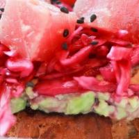 Tuna Poke · smashed avocado, tuna poke, pickled cabbage, sesame seeds