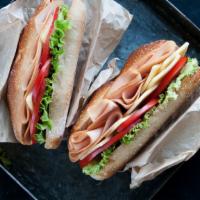 Turkey & Pastrami Avocado Sandwich · Fresh sandwich topped with turkey, Pastrami, avocado, swiss cheese, onion, peppers, and hone...