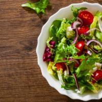 Garden Salad · Fresh salad made with crispy leaf lettuce, romaine lettuce, cucumbers, carrots, tomatoes, an...