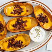 Potato Skins · 5 Jumbo skins topped with cheddar cheese and bacon.