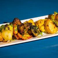 Tandoori Mixed Vegetables · Mixed vegetables marinated in yogurt and spices and cooked in a clay oven.