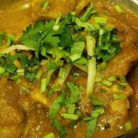 Chicken Curry · Fresh ginger, onion in a tomato gravy. Your choice of white or dark meat.