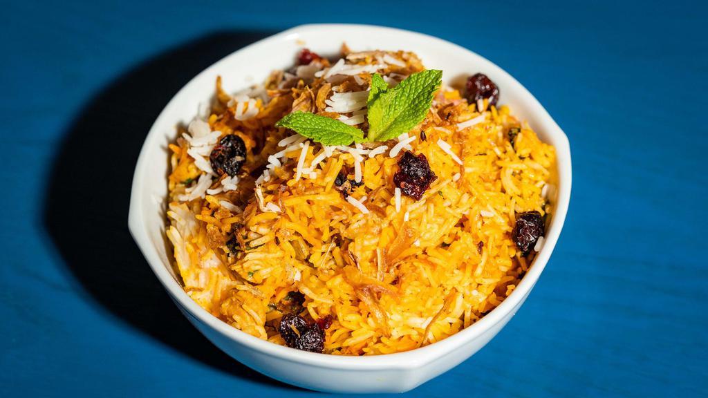 Chicken Biryani · Basmati rice cooked with boneless chicken, herbs and spices.