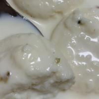 Rasmalai · Cottage cheese in a special condensed milk flavored with rose water.