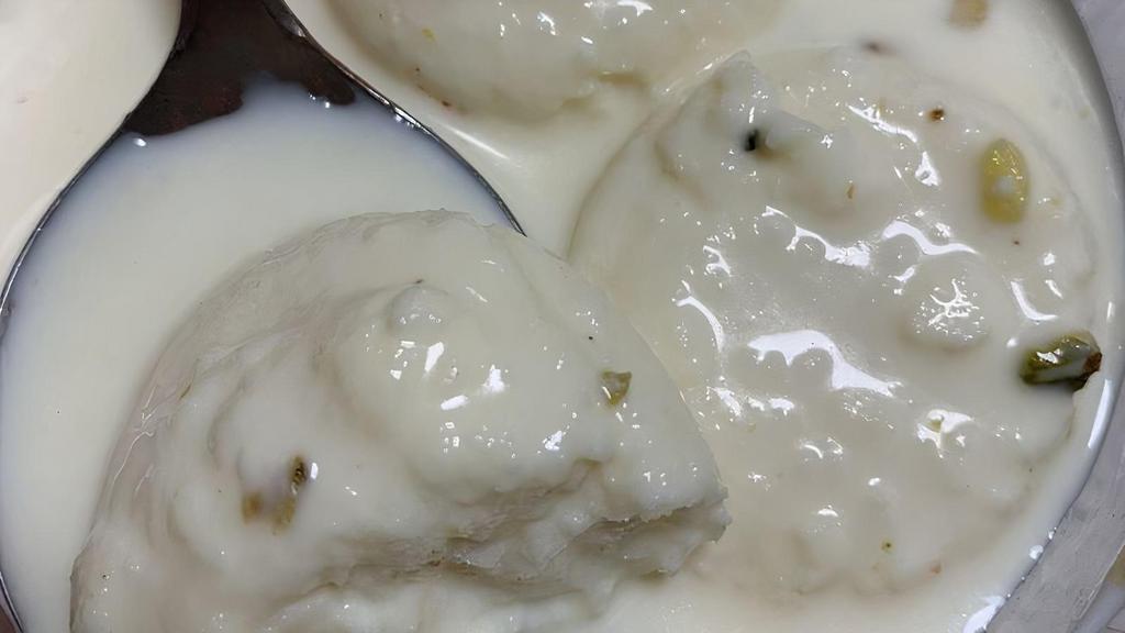 Rasmalai · Cottage cheese in a special condensed milk flavored with rose water.