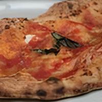 Calzone Classico · Filled with fresh mozzarella, fresh ricotta, salame. On top tomato sauce, basil