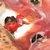 Truffle Burrata Pizza · fresh burrata filled with black and white truffle cream, grape tomatoes, prosciutto di Parma...