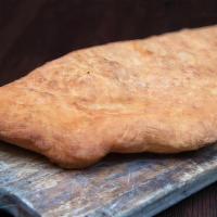 Calzone Fritto · Fried calzone filled with fresh mozzarella, fresh ricotta, cherry tomatoes and salame