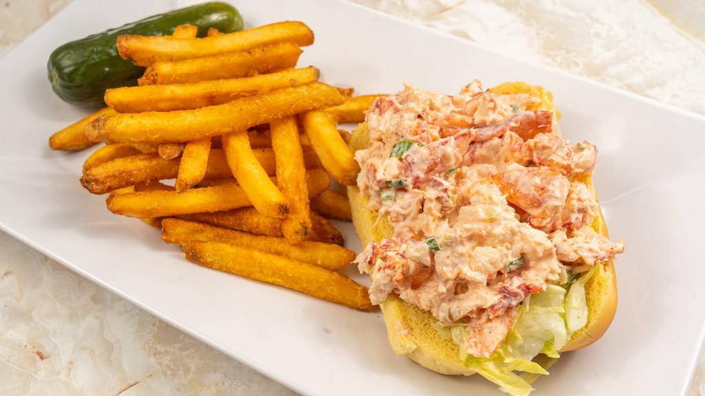 Maine Lobster Roll · Fresh lobster meat tossed in mayo. Served with chips and a pickle.