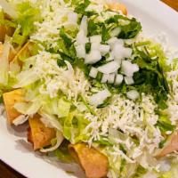 Flautas  · Four fried rolled up tortillas with rice and beans on the side.