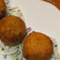 Crab Cake Medallions · LUMP CRAB MEAT + PICKLED FENNEL & RED ONION + ROMESCO SAUCE + MICRO GREENS
