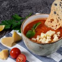 Tomato Basil Soup & Cheese · Fresh tomato basil soup served with cheese.