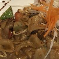 Drunken Noodle · Spicy. Sauteed flat noodles with egg, fresh basil, fresh garlic, chili, bell pepper, bean sp...