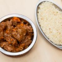 Lamb Curry · Chunks of lamb cooked in mild onion and tomato based sauc
