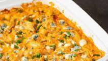 Chicken Wing Dip · Homemade topped with melted Cheddar cheese, served with corn tortillas chips.