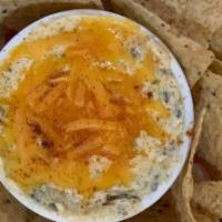 Spinach & Cheddar Dip · Rochester famous topped with melted Cheddar served with corn tortilla chips.