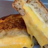 Grilled 4 Cheese · Our gooey 4 cheese blend on crispy griddled Orwasher's sourdough bread