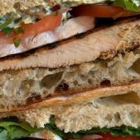 Grilled Chicken And Brie · Grilled chicken, French brie, plum tomato, baby arugula, red onion and her mayo on toasted c...