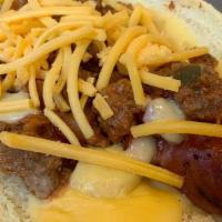 Sloppy Dog · Our classic grilled dog topped with sloppy joe and cheddar cheese