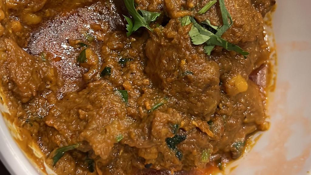 Lamb Curry  · Slowly lamb cooked with house special spices