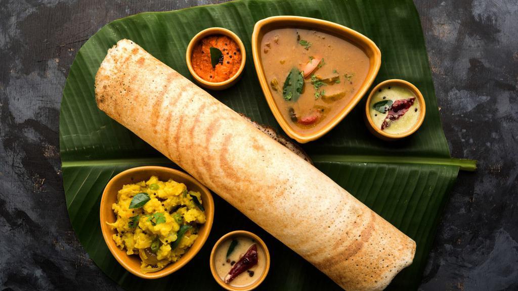 Chicken Tikka Dosa · A fresh made thin Indian crepe made from a fermented batter of lentils and rice stuffed with our world famous chicken tikka.