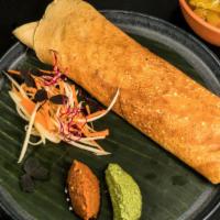 Chicken Dosa · A fresh made thin Indian crepe made from a fermented batter of lentils and rice stuffed with...