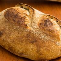 Country Sourdough · A loaf of our homemade country sourdough bread.