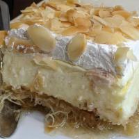 Ekmek · Custard and whipped cream pastry with syrup.