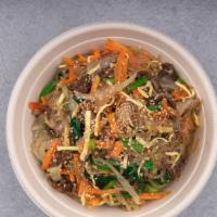 Jap Chae · Sweet potato glass noodles tossed with beef, sautéed onions/scallions, egg strips, spinach, ...