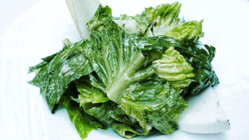 Green Salad · Hearts of romaine, dill, spring onions, manouri cheese and our Milos house dressing