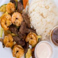 Triple Delight · Chicken, beef, shrimp with mixed vegetables in brown sauce.