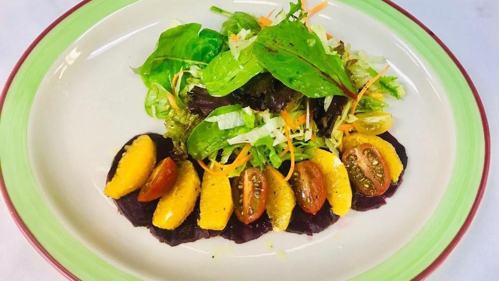 House Salad · Romaine lettuce, carrots, orange, beets onion, tomato and a citrus vinaigrette.