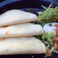 Fish Tacos · Three soft corn tortillas filled with Yucatan-style fried catch of the day and cabbage with ...