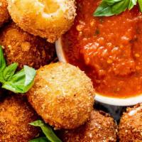 Fried Mozzarella · Our version of our Italian classic crunchy and cheesy with side of pomodoro sauce.