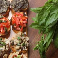 Bruschetta Sampler · Grilled ciabatta bread rubbed with garlic drizzled with olive oil topped with tomato salad, ...