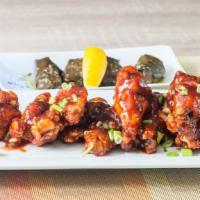 Tzatziki Wings · Garlic, olive oil, honey, oregano, and hot bbq glaze. Served with our own sweet chili tzatzi...