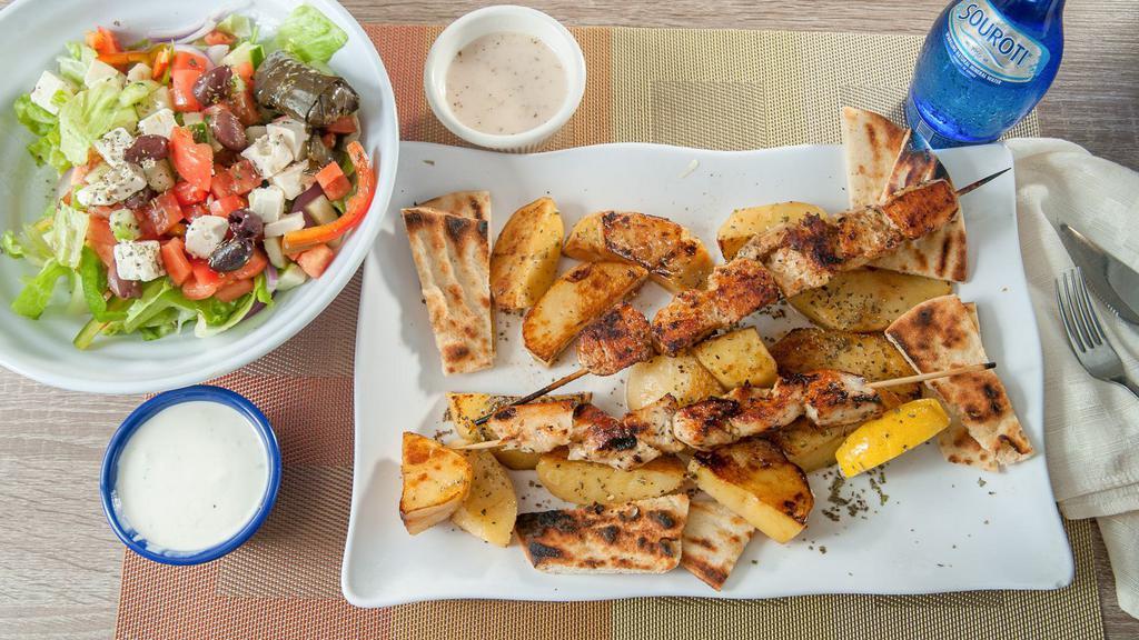 Chicken Souvlaki Platter · Served with salad, pita, tzatziki or tahini sauce and choice of lemon potatoes, rice, or french fries.