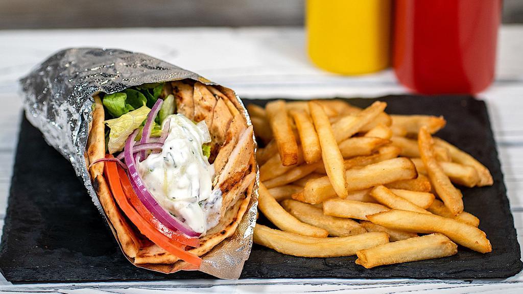Chicken Gyro Meal · Served with 1 Side, lettuce, tomato, onions, and our house-made Tzatziki sauce on a warm pita bread.