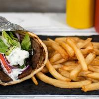 Lamb Gyro Meal  · Served with 1 Side, lettuce, tomato, onions, and our house-made Tzatziki sauce on a warm pit...