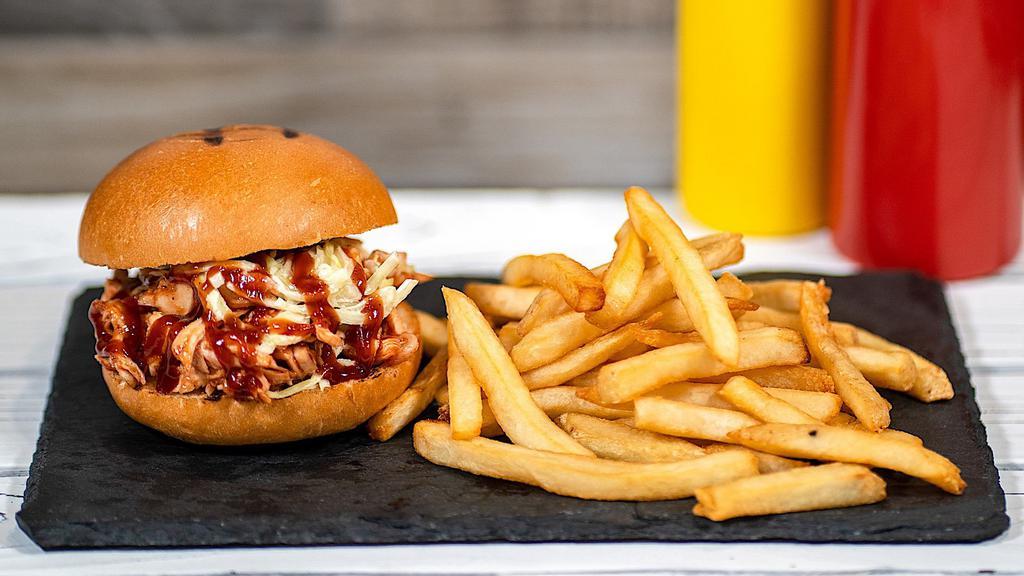 Bbq Pulled Chicken Burger  · Flame-grilled shredded chicken glazed in BBQ sauce & house-made coleslaw on a toasted bun.