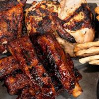 4Pc Chicken + 5Pc Ribs Special · 1/2 chicken & 5 pieces of BBQ Ribs served with 2 regular sides, 2 sauces & 1 pita bread.