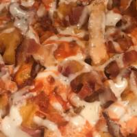 Loaded Fries · Fries topped with melted cheese, and bacon, ranch dressing and hot sauce.
