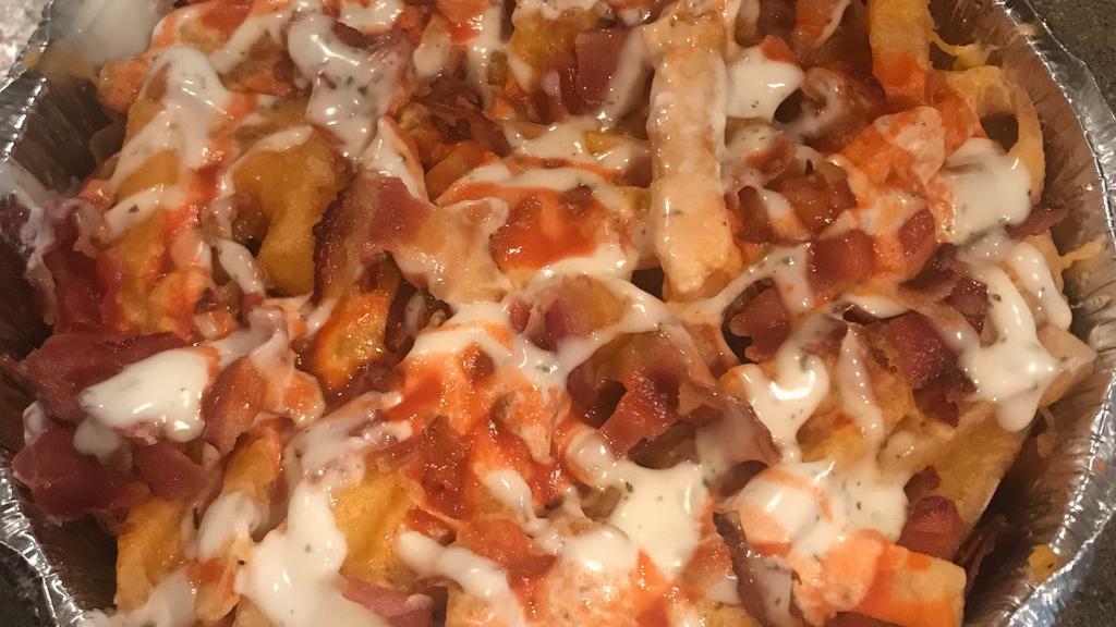Loaded Fries · Fries topped with melted cheese, and bacon, ranch dressing and hot sauce.