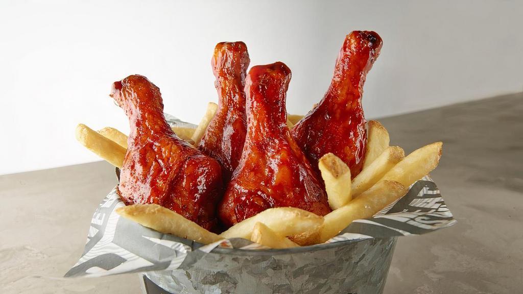 Bucket Of Bones · Four Smoked Chicken Drumsticks tossed in our sweet BBQ glaze and served on a bed of fries.