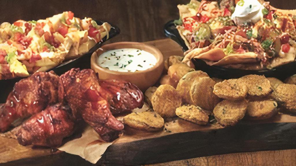 Bbq Crowd Pleaser · Hickory smoked chicken wings with sweet BBQ glaze, mini BBQ Mag Nachos, loaded fries, crispy fried pickles with buttermilk ranch.