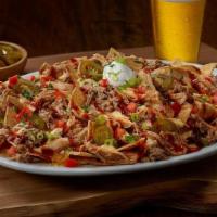 The Bbq Mag-Nacho · Loaded BBQ Mag-Nachos! Freshly fried tortilla chips topped with BBQ pulled chicken, hickory ...