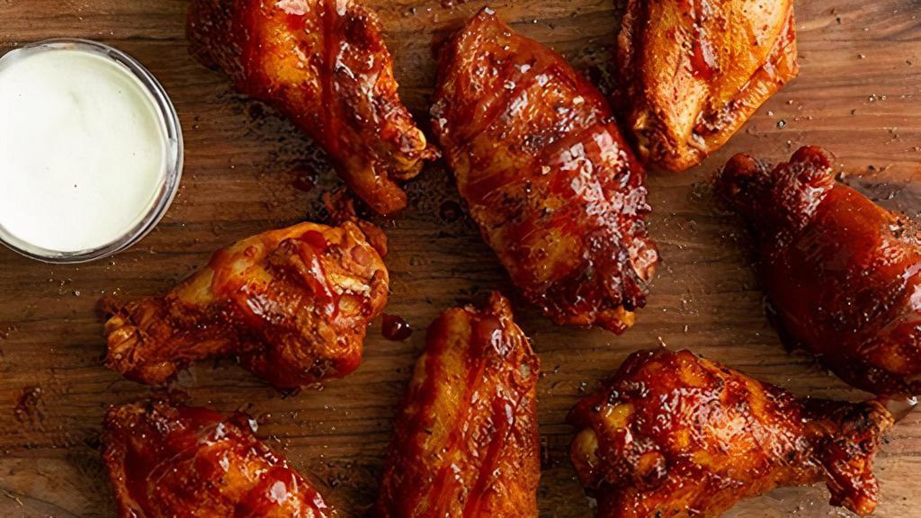 16 Jumbo Smoked Wings · House smoked wings tossed in your choice of sauce or dry rub. Get them the Bones Way, dusted with our house seasoning and drizzled with sweet bbq glaze.