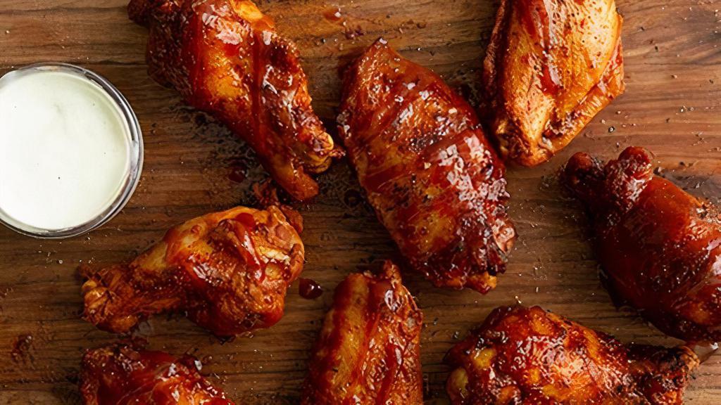 16 Jumbo Wings · Giant, juicy, rubbed, golden fried wings tossed in your choice of sauce or dry rub. Get them the Bones Way, dusted with our house seasoning and drizzled with sweet bbq glaze.