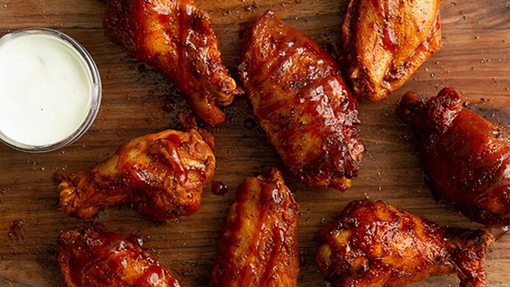 8 Jumbo Wings · Giant, juicy, rubbed, golden fried wings tossed in your choice of sauce or dry rub. Get them the Bones Way, dusted with our house seasoning and drizzled with sweet bbq glaze.